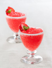 Strawberry slushie cups decorated with mint