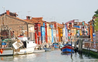 houses with blue red yellow green of the lagoon island of Burano