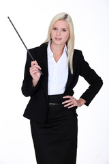 Blond instructor holding stick