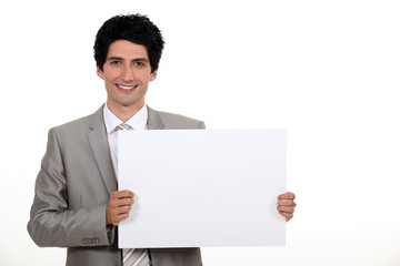 Businessman with a blank board