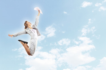 Obraz premium Image of jumping businesswoman