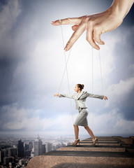 Business woman marionette