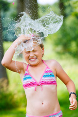 girl having fun outdoor with water