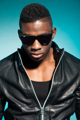 Fototapeta premium Cool urban stylish black american man. Fashion studio shot.