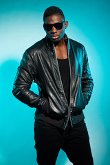 Fototapeta premium Cool urban stylish black american man. Fashion studio shot.