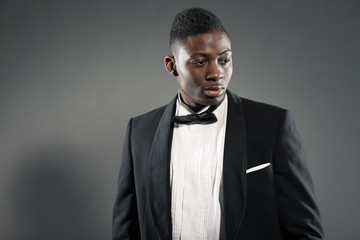 Cool stylish black american man in gala suit. Fashion shot.