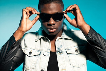 Cool urban stylish black american man. Fashion studio shot.