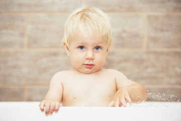 Blond baby in the bathroom