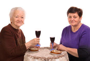 Happy mother with daughter drinking wine