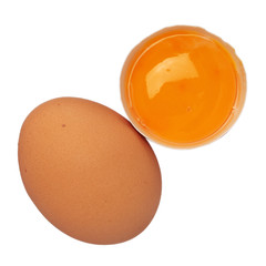 Whole egg and egg yolk in shell isolated on white