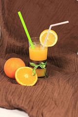 Freshly squeezed orange juice with a lemon slice