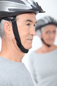 Elderly Couple With Cycle Helmets