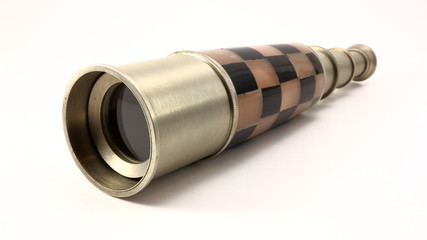 Antique pewter and mosaic nautical telescope on white background