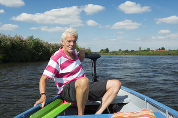man in boat at the river