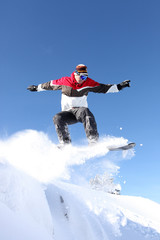 A snowboarder gliding through the air