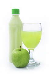 bottle and a glass of apple juice with apple green