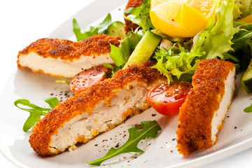 Fried chicken breast and vegetables