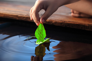 leaf ship in children hand