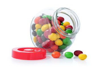 colorful candy in glass bottles isolated on white background