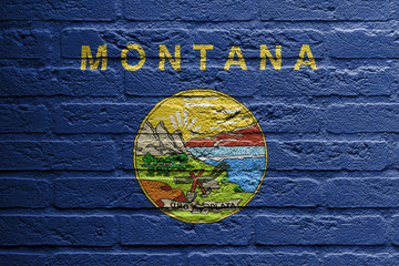 Brick wall with a painting of a flag, Montana