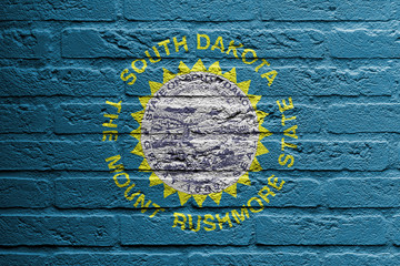 Brick wall with a painting of a flag, South Dakota