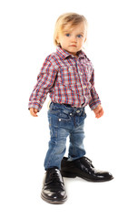 Little boy in father's shoes