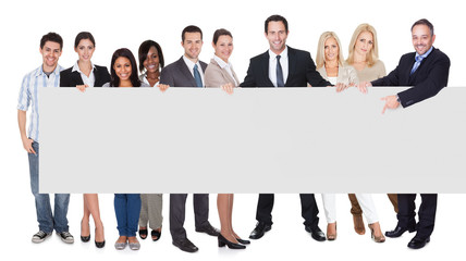 Fototapeta premium Group of business people presenting empty banner