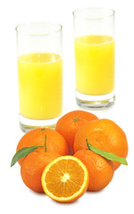 two glasses of juice and tangerine