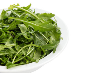 fresh rucola leaves in a bowl