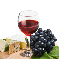glass of red wine with grapes
