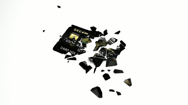 Credit or debit card drops and falls apart.