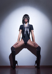 Fototapeta na wymiar Fashion shoot of a young woman posing in erotic lingerie