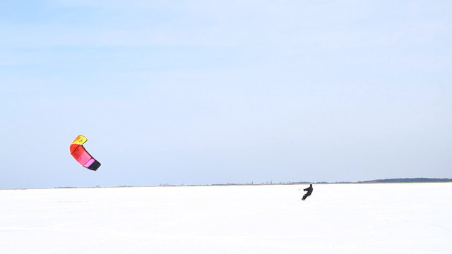 Winter Snowkiting on the ice lake