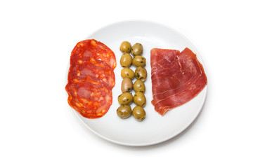 Spanish tapas platter isolated on a white studio background.