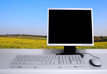 PC with black desktop and green field background