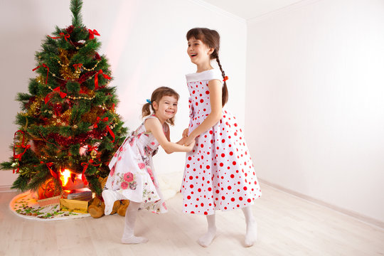 girls at a New Year tree