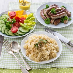 Sauerkraut, Nuremberg bratwurst and salad