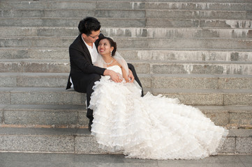 Happy bride and groom on their wedding day .