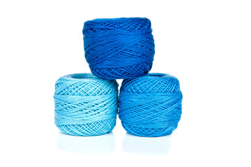 Bright balls of yarn isolated on white