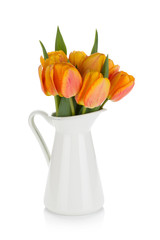 Orange tulips bouquet in jug