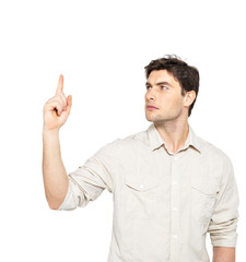 Young serious man points with finger up