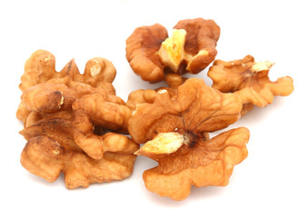 Halves of walnuts on white background