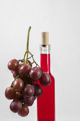 Red Grapes and wine bottle