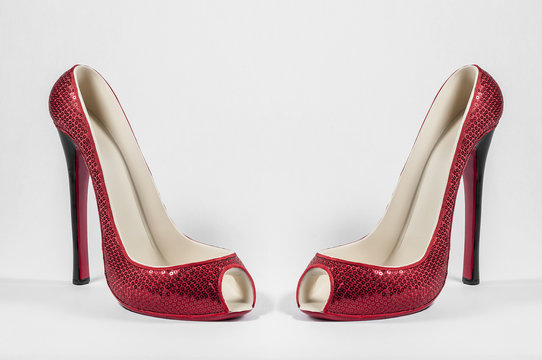 Pair of red high heel shoe