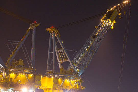 Large cranes on top of a construction vessel