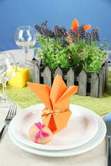 Easter table setting on color background