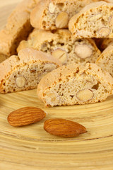 Aromatic cookies cantuccini on wooden plate close-up