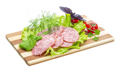 Sausages with salad and basil