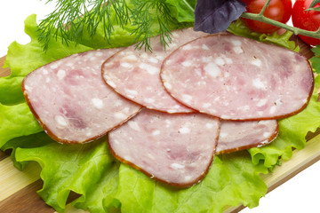 Sausages with salad and basil