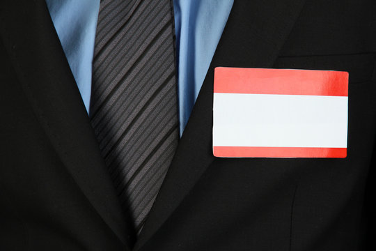 Blank Nametag On Businessman's Black Suit Close Up